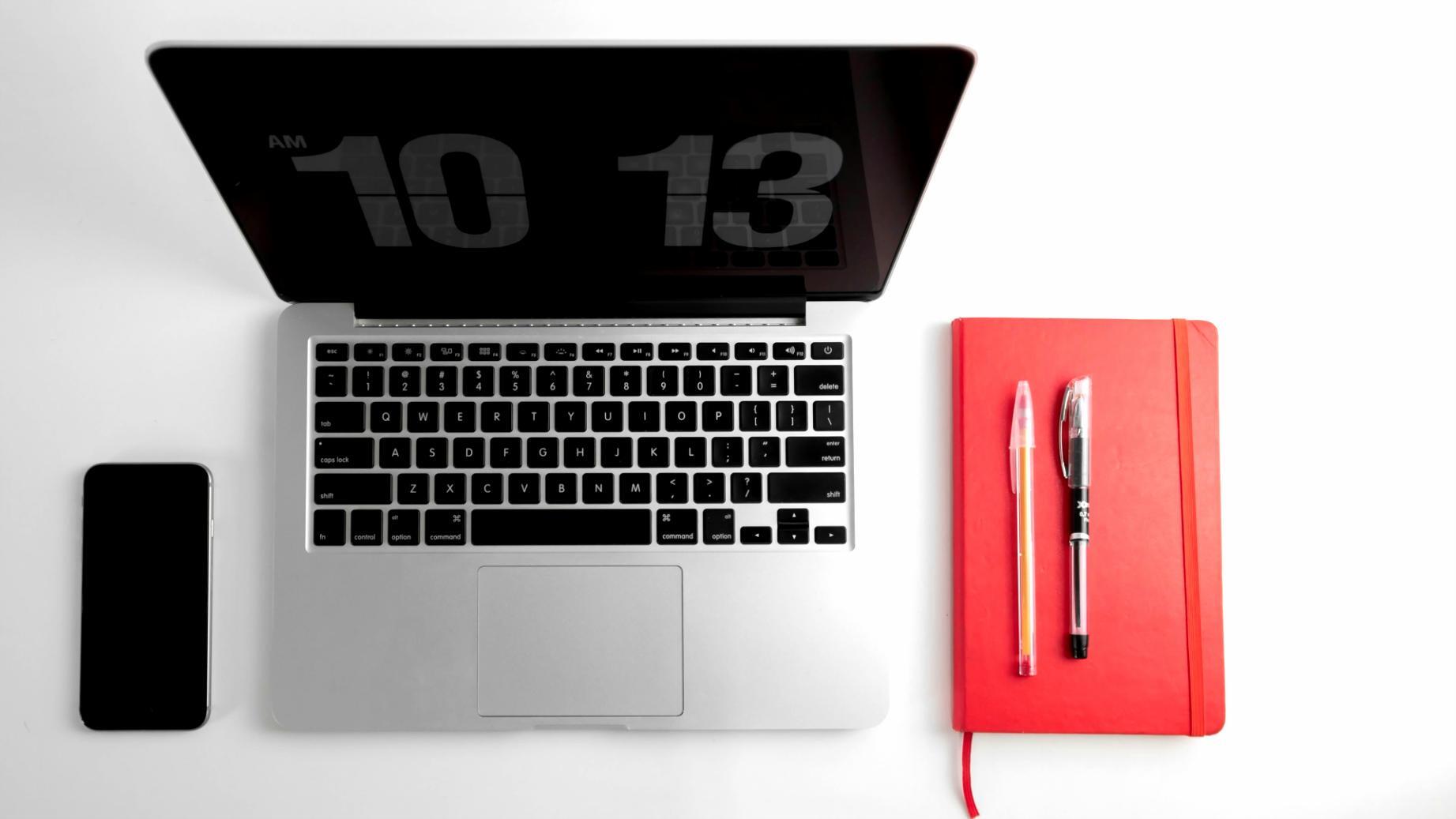 Person working on budget planning with calculator and notes